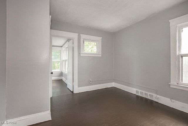 11515 Hopkins Ave, Cleveland, OH 44108 - unfurnished room with dark wood finished floors and baseboards