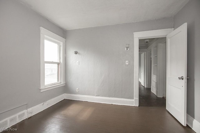 11515 Hopkins Ave, Cleveland, OH 44108 - spare room with dark wood-type flooring and baseboards
