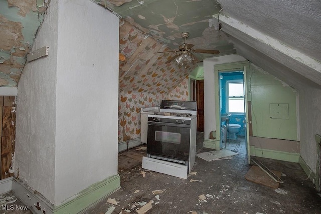 11515 Hopkins Ave, Cleveland, OH 44108 - kitchen with white gas stove, lofted ceiling, and a ceiling fan