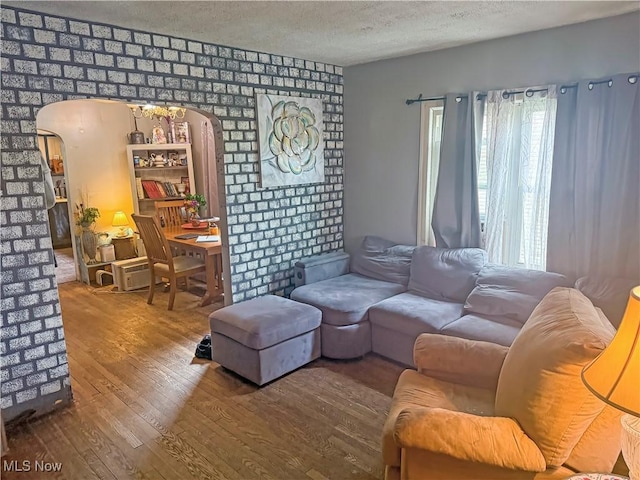 114 S 12th St, Weirton, WV 26062 - living area with arched walkways, hardwood / wood-style floors, healthy amount of natural light, and a textured ceiling