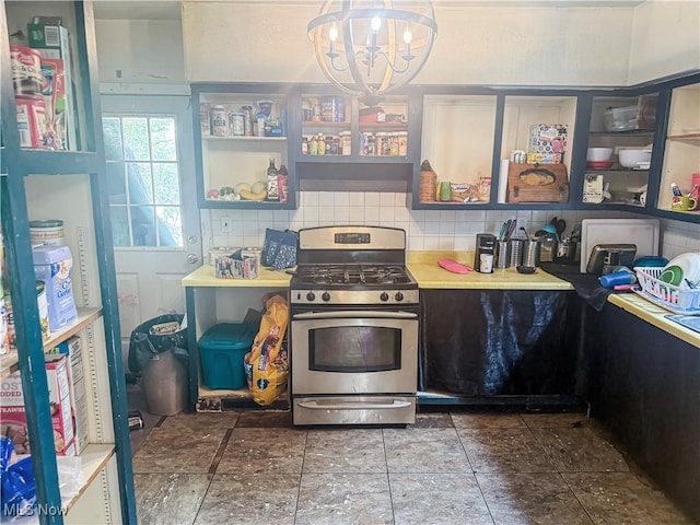 114 S 12th St, Weirton, WV 26062 - kitchen featuring gas range, a chandelier, decorative backsplash, open shelves, and stone finish flooring