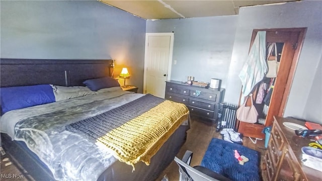 114 S 12th St, Weirton, WV 26062 - bedroom featuring radiator and wood finished floors