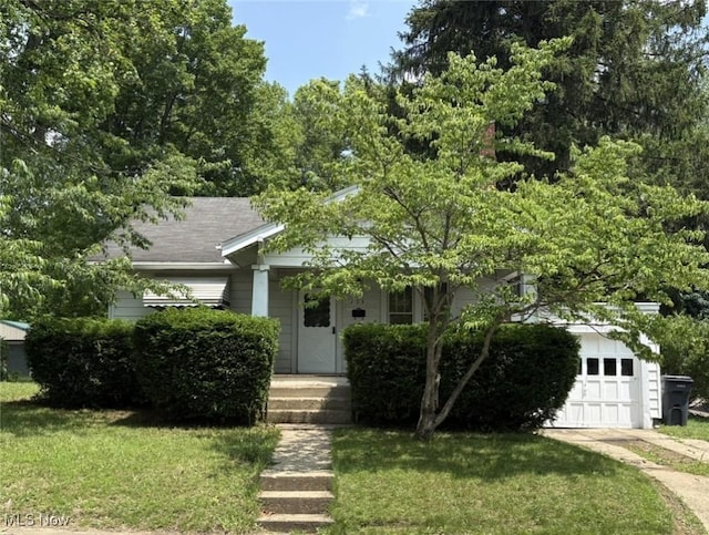 105 S Maple Hts, New Lexington, OH 43764 - obstructed view of property featuring a front yard and a garage