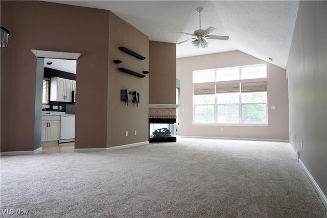 194 Vista Cir, North Olmsted, OH 44070 - unfurnished living room featuring ceiling fan, light carpet, a fireplace, and high vaulted ceiling