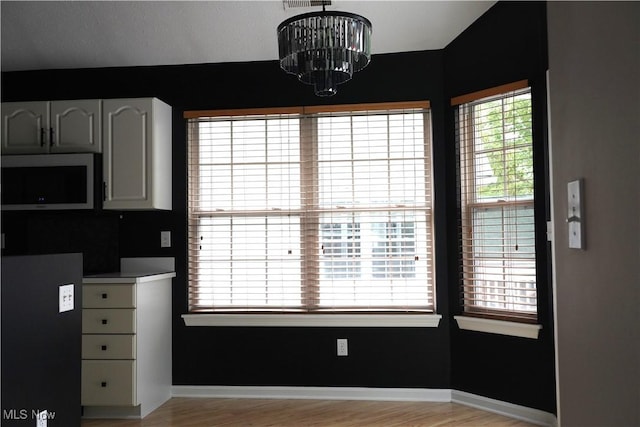 194 Vista Cir, North Olmsted, OH 44070 - unfurnished dining area featuring light wood-style flooring and a chandelier