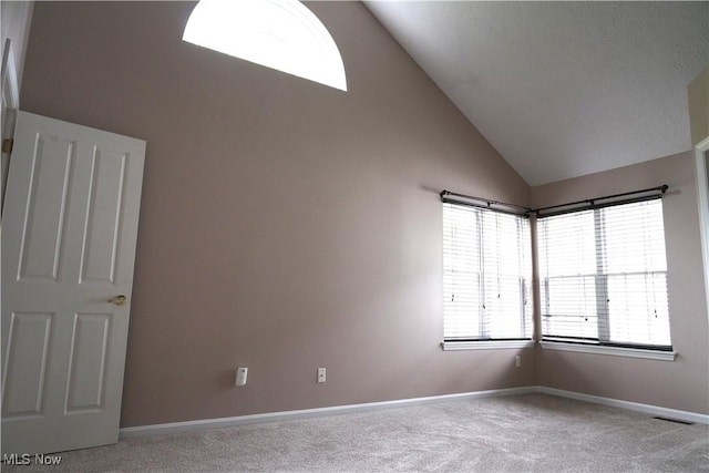 194 Vista Cir, North Olmsted, OH 44070 - carpeted empty room with lofted ceiling and baseboards