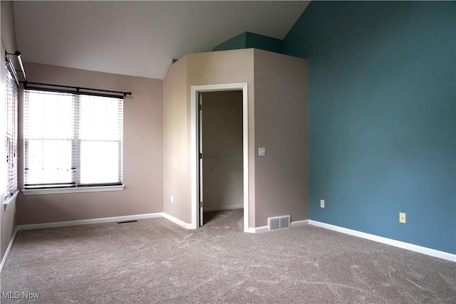 194 Vista Cir, North Olmsted, OH 44070 - unfurnished bedroom with carpet floors, vaulted ceiling, a spacious closet, and a closet