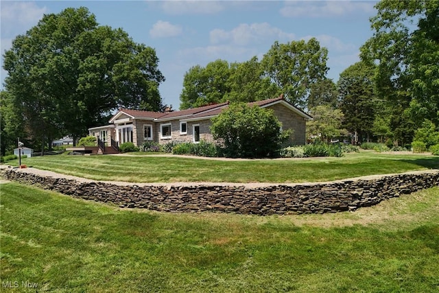 3901 Beaumont Dr, Weirton, WV 26062 - view of front of property featuring a front lawn, stone siding, and a wooden deck