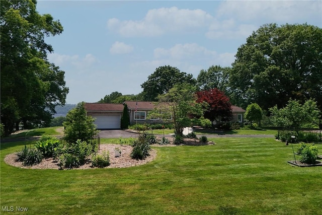 3901 Beaumont Dr, Weirton, WV 26062 - view of front facade featuring a garage, a front yard, and driveway