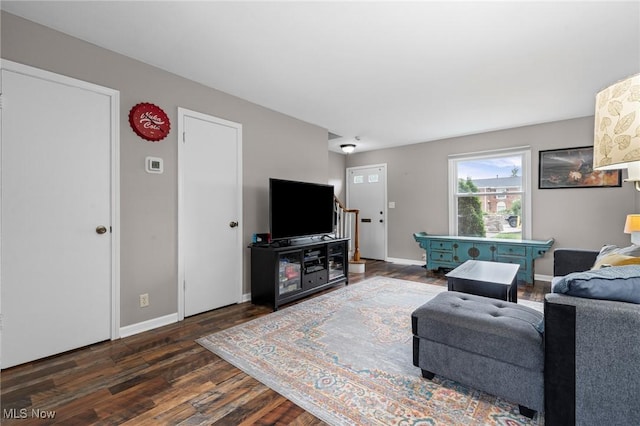 2400 Arlington Dr, Lyndhurst, OH 44124 - living area with dark wood-style floors and baseboards