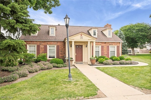 2400 Arlington Dr, Lyndhurst, OH 44124 - view of front facade featuring brick siding, a front yard, a chimney, and roof with shingles