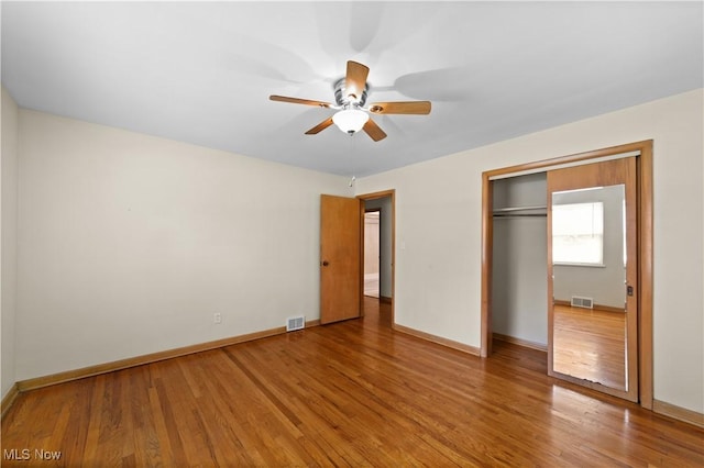 792 Miner Rd, Highland Heights, OH 44143 - unfurnished bedroom with wood finished floors, a closet, and a ceiling fan