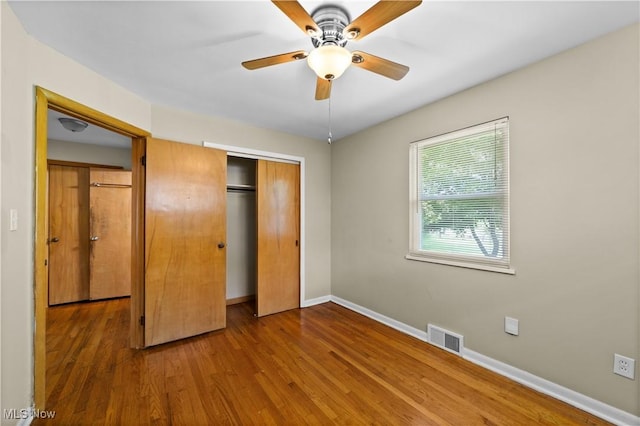 792 Miner Rd, Highland Heights, OH 44143 - unfurnished bedroom with wood finished floors, a closet, and ceiling fan