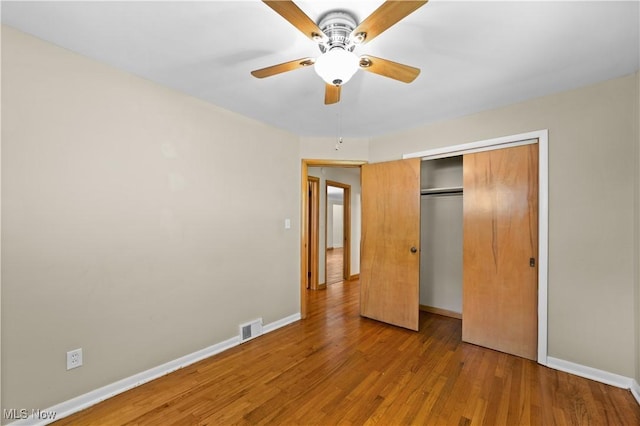 792 Miner Rd, Highland Heights, OH 44143 - unfurnished bedroom with light wood-style flooring, a closet, and a ceiling fan