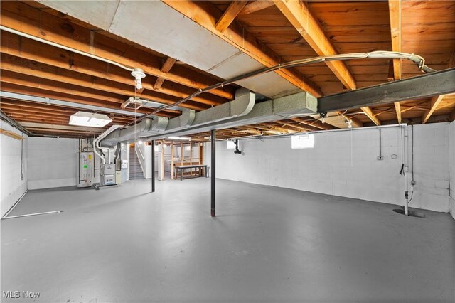 792 Miner Rd, Highland Heights, OH 44143 - below grade area featuring water heater, heating unit, and stairs