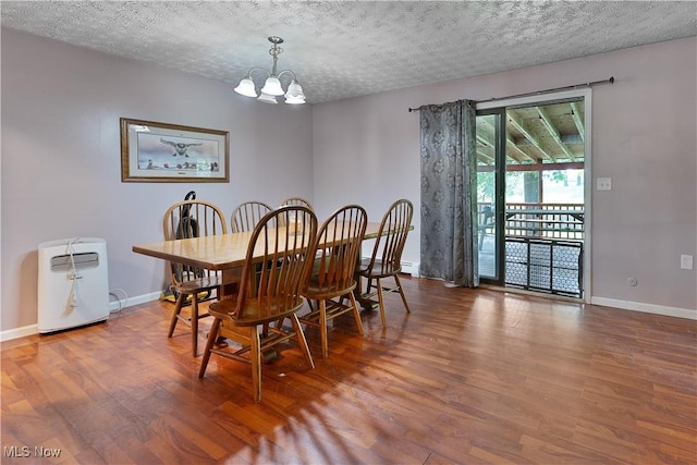 3378 State Route 164, Leetonia, OH 44431 - dining area with a chandelier, wood finished floors, and a textured ceiling