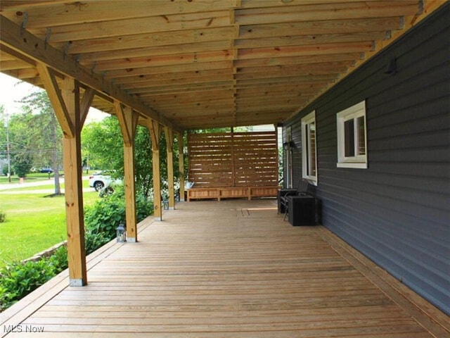 8240 Bellflower Rd, Mentor, OH 44060 - wooden deck featuring a yard