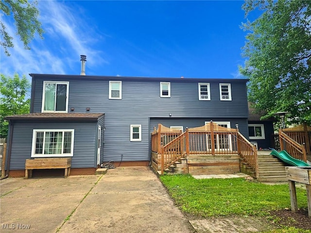8240 Bellflower Rd, Mentor, OH 44060 - back of house featuring a deck and a patio