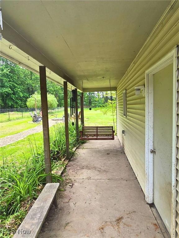8240 Bellflower Rd, Mentor, OH 44060 - covered porch featuring a lawn