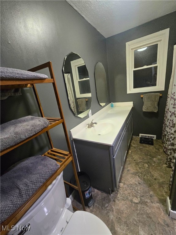 8240 Bellflower Rd, Mentor, OH 44060 - full bath with vanity and a textured ceiling