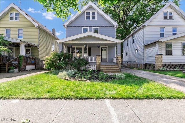 3400 W 118th St, Cleveland, OH 44111 - american foursquare style home with a porch