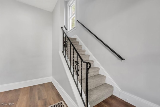 3400 W 118th St, Cleveland, OH 44111 - staircase featuring baseboards and wood finished floors