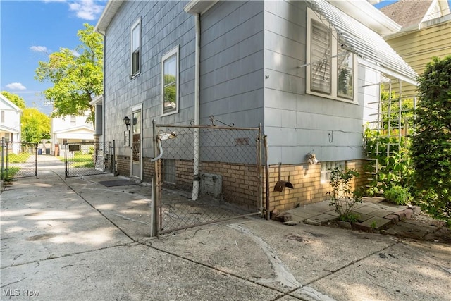 3400 W 118th St, Cleveland, OH 44111 - view of side of home with a gate and crawl space