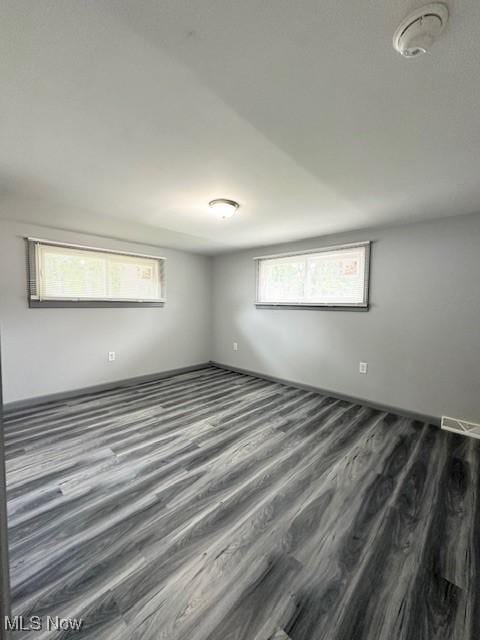 362 E 47th St, Lorain, OH 44052 - spare room featuring wood finished floors and a smoke detector