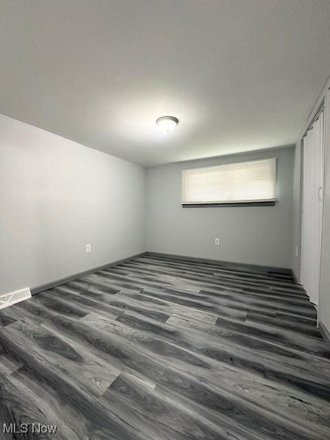 362 E 47th St, Lorain, OH 44052 - spare room featuring dark wood-style flooring