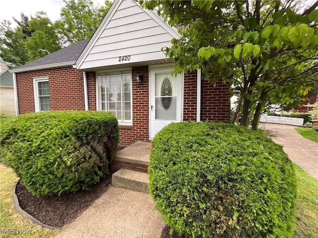 2420 Empire Rd NE, Canton, OH 44705 - doorway to property featuring brick siding