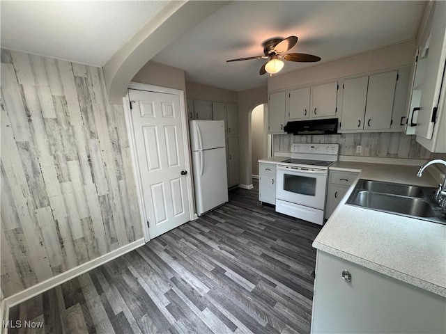2420 Empire Rd NE, Canton, OH 44705 - kitchen featuring white appliances, range hood, arched walkways, light countertops, and ceiling fan