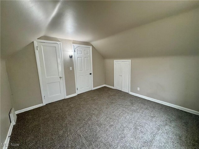 2420 Empire Rd NE, Canton, OH 44705 - bonus room with dark colored carpet and vaulted ceiling