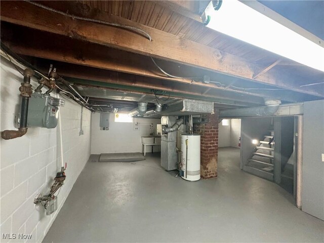 2420 Empire Rd NE, Canton, OH 44705 - basement featuring water heater, stairway, and electric panel