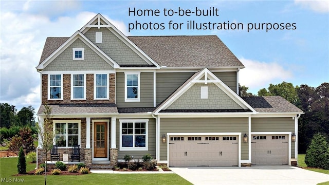52 Boulder Blvd, Peninsula, OH 44264 - craftsman inspired home with an attached garage, driveway, a front lawn, covered porch, and stone siding