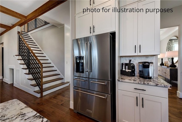 52 Boulder Blvd, Peninsula, OH 44264 - kitchen with high quality fridge, dark wood-style flooring, tasteful backsplash, light stone countertops, and white cabinets