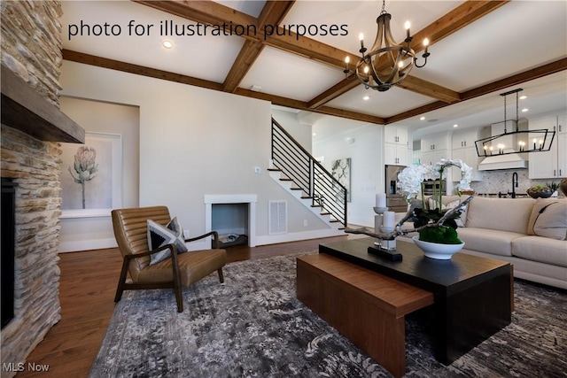 52 Boulder Blvd, Peninsula, OH 44264 - living area featuring a chandelier, dark wood-style flooring, beam ceiling, stairway, and coffered ceiling