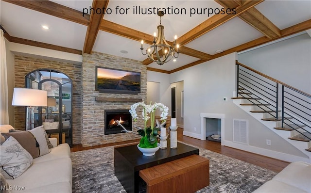 52 Boulder Blvd, Peninsula, OH 44264 - living area with a stone fireplace, stairs, wood finished floors, beam ceiling, and coffered ceiling