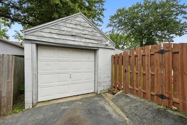 2557 Ogden Ave, Akron, OH 44312 - detached garage featuring asphalt driveway