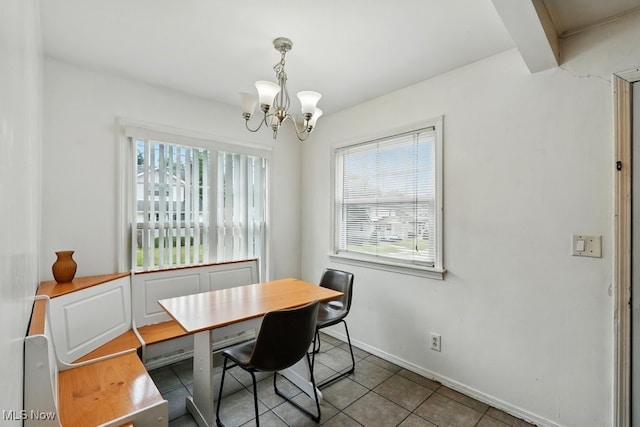 2557 Ogden Ave, Akron, OH 44312 - tiled dining space featuring healthy amount of natural light and a chandelier