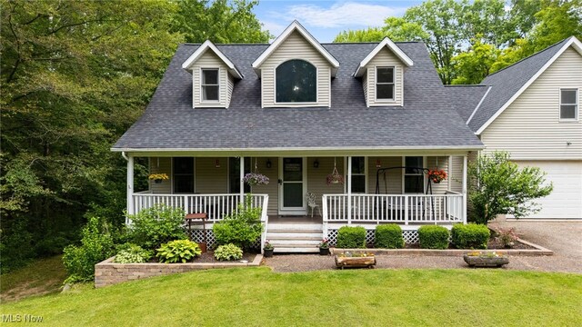 12230 Country Oaks Trl, Chardon, OH 44024 - new england style home with a front lawn, a porch, a shingled roof, a garage, and driveway
