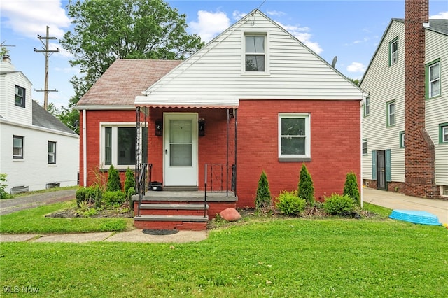 922 Winton Ave, Akron, OH 44320 - bungalow with brick siding and a front lawn