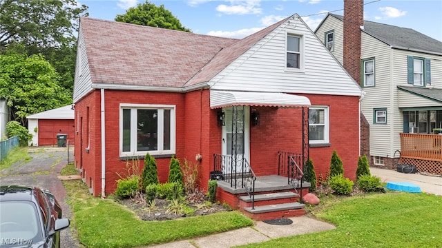 922 Winton Ave, Akron, OH 44320 - view of front facade with brick siding and a front lawn