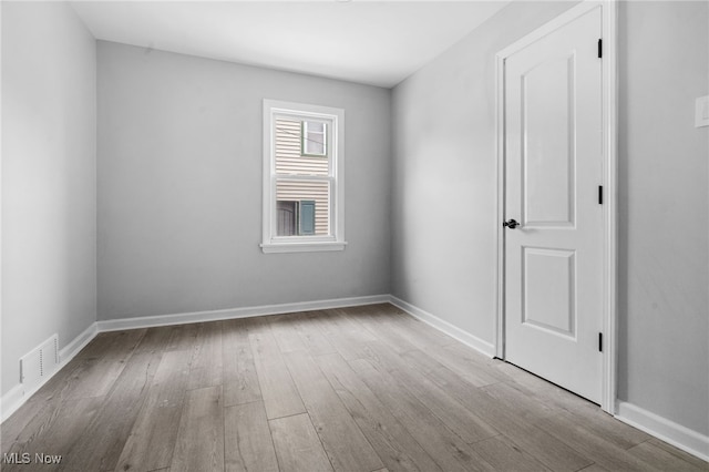 922 Winton Ave, Akron, OH 44320 - empty room with wood finished floors and baseboards