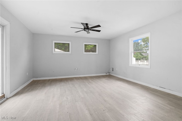 922 Winton Ave, Akron, OH 44320 - spare room with plenty of natural light, light wood finished floors, and ceiling fan