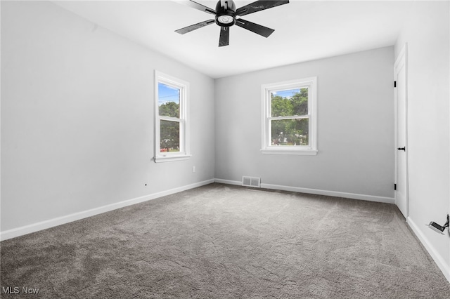 922 Winton Ave, Akron, OH 44320 - spare room featuring plenty of natural light, carpet floors, and a ceiling fan