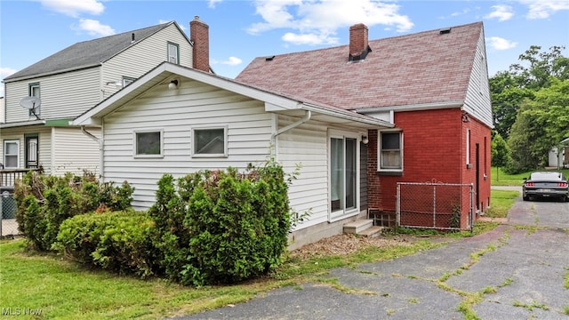 922 Winton Ave, Akron, OH 44320 - back of property with a chimney and brick siding