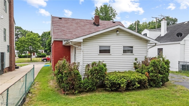 922 Winton Ave, Akron, OH 44320 - rear view of house featuring a chimney and roof with shingles