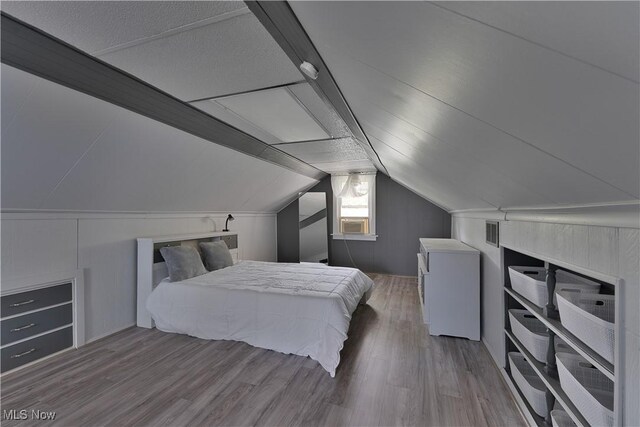 374 Glendola Ave NW, Warren, OH 44483 - bedroom featuring fridge, wood finished floors, and vaulted ceiling