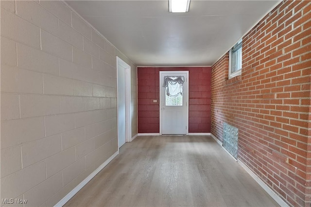 374 Glendola Ave NW, Warren, OH 44483 - doorway to outside with wood finished floors and baseboards