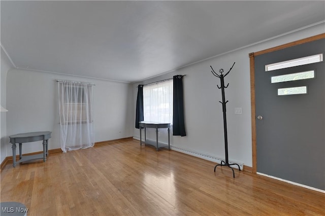 374 Glendola Ave NW, Warren, OH 44483 - entryway with light wood-type flooring and ornamental molding